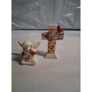 Sitting Angel With Bird And A Cross